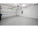 Clean, spacious two-car garage with epoxy flooring and white walls at 5932 Red Mangrove Ln, Bradenton, FL 34210