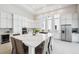 Spacious kitchen with quartz counters, stainless steel appliances, and a large island perfect for entertaining Gathering and friends at 5932 Red Mangrove Ln, Bradenton, FL 34210