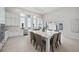 Gorgeous kitchen showcasing a huge island and a seamless indoor-outdoor living with a view of the refreshing pool area at 5932 Red Mangrove Ln, Bradenton, FL 34210