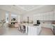 Open floor plan with gourmet kitchen and living room featuring abundant natural light and modern finishes, ideal for entertaining at 5932 Red Mangrove Ln, Bradenton, FL 34210