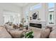 Bright, modern living room featuring a linear fireplace and lots of natural light at 5932 Red Mangrove Ln, Bradenton, FL 34210