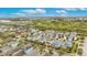 Aerial view of the neighborhood showcasing a variety of home colors and proximity to nearby wooded areas at 624 Winterside Dr, Apollo Beach, FL 33572