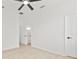 Bright bedroom with an ensuite bathroom, ceiling fan and neutral paint colors at 7604 Dragon Fly Loop, Gibsonton, FL 33534