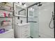 Bathroom with a glass shower, stylish vanity, modern fixtures, and subway tile walls at 8025 N Gomez Ave, Tampa, FL 33614