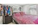 Bedroom featuring natural light from two windows and closet rack at 8025 N Gomez Ave, Tampa, FL 33614