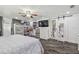 Bright bedroom with a large bed, closet space, and access to an ensuite bathroom at 8025 N Gomez Ave, Tampa, FL 33614