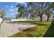 Paver driveway leading to a large fenced backyard, offering ample parking space at 8025 N Gomez Ave, Tampa, FL 33614
