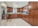Spacious kitchen features custom wood cabinets, stainless steel appliances, and granite countertops at 8025 N Gomez Ave, Tampa, FL 33614