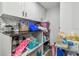 Bright laundry room with cabinets, shelving, cleaning supplies, and decor at 8025 N Gomez Ave, Tampa, FL 33614