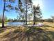 Scenic view of a pond surrounded by mature trees and a paved walkway at 926 43Rd S St, St Petersburg, FL 33711