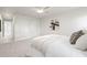 A large bedroom with an ensuite bathroom features a neutral color palette and plush carpet at 9402 Stonewall Ln, New Port Richey, FL 34655