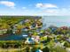 Spectacular waterfront residence with a private dock, creating a perfect oasis for waterfront relaxation and recreation at 101 Augusta Ave, Palm Harbor, FL 34683