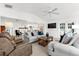 Bright living room features neutral walls, tile floors and comfortable seating at 101 Augusta Ave, Palm Harbor, FL 34683