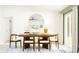 Bright dining room with modern decor, wooden table, and stylish chairs at 10212 Gentle Rain Dr, Land O Lakes, FL 34638