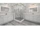 Elegant bathroom with glass shower, double sinks, and stylish mirrors at 10800 Tarflower Dr # 202, Venice, FL 34293