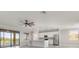Bright kitchen with stainless steel appliances and a view of the screened patio at 10800 Tarflower Dr # 202, Venice, FL 34293