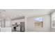 Bright kitchen featuring white cabinets, modern appliances, and natural light at 10800 Tarflower Dr # 202, Venice, FL 34293