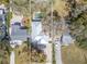 An aerial shot shows a well-maintained single-Gathering home outlined on a lot with pool at 1108 Commodore St, Clearwater, FL 33755