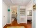 Hallway with views into the bedrooms showcasing hardwood floors and bright, airy spaces at 1108 Commodore St, Clearwater, FL 33755