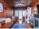 Comfortable living room with hardwood floors, wood walls, stylish decor, and ample natural light at 1108 Commodore St, Clearwater, FL 33755