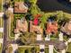 Overhead view of a residential neighborhood, showcasing a home with a screened pool at 1213 Halifax Ct, Tarpon Springs, FL 34688