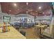 Spacious bar area with high top tables and chairs plus mounted TVs at 1213 Halifax Ct, Tarpon Springs, FL 34688