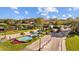 A beautiful gated community with a water fountain feature and manicured landscaping at 1213 Halifax Ct, Tarpon Springs, FL 34688