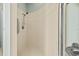 Shower with tile surround and grab bar at 1213 Halifax Ct, Tarpon Springs, FL 34688