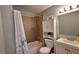 Cozy bathroom with tiled shower/tub combo, modern vanity with storage, and neutral walls creating a relaxing space at 1258 Nicholson St, Clearwater, FL 33755