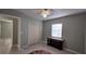 Spacious room featuring a ceiling fan, a window and large closet doors at 1258 Nicholson St, Clearwater, FL 33755