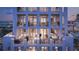 Luxury condo building showcasing balconies with outdoor furniture and city views at twilight at 126 4Th Ne Ave # 2201, St Petersburg, FL 33701