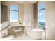 Luxurious bathroom with soaking tub, vanity area, and stunning water view at 126 4Th Ne Ave # 2201, St Petersburg, FL 33701