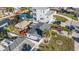 Captivating aerial view of a home featuring a tiki hut, hot tub, and ample parking space at 13429 Lisa Dr, Hudson, FL 34667
