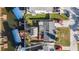 An overhead view shows a home with a tiki hut, boat lift, and convenient waterfront access at 13429 Lisa Dr, Hudson, FL 34667