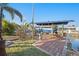 Private boat dock featuring a boat lift, seating, and scenic waterfront views, ideal for boating enthusiasts at 13429 Lisa Dr, Hudson, FL 34667