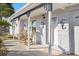 Charming front porch featuring comfortable seating and decorative accents, enhancing curb appeal at 13429 Lisa Dr, Hudson, FL 34667