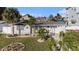 Charming single-story home boasts a well-manicured lawn and inviting curb appeal with a cozy front porch at 13429 Lisa Dr, Hudson, FL 34667