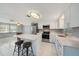 Modern kitchen with a center island, stainless steel appliances, and ample countertop space at 13429 Lisa Dr, Hudson, FL 34667
