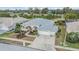 An aerial view showcases this well-maintained home with lush landscaping and a spacious three-car garage at 13941 Talmage Loop, Hudson, FL 34667