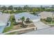 Aerial view of house, landscaping, and three car garage at 13941 Talmage Loop, Hudson, FL 34667