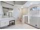 Bright bathroom with walk-in shower and walk-in tub at 13941 Talmage Loop, Hudson, FL 34667