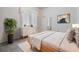 Simple bedroom with bright white walls, big window, and a relaxing and uncluttered space at 13941 Talmage Loop, Hudson, FL 34667