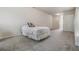 Bedroom with neutral carpet, ceiling fan, and access to ensuite bathroom at 13941 Talmage Loop, Hudson, FL 34667