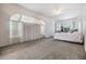 Spacious carpeted bedroom with large windows and ample natural light at 13941 Talmage Loop, Hudson, FL 34667
