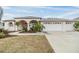 Lovely single-story home with a three car garage, arched entry and mature landscaping at 13941 Talmage Loop, Hudson, FL 34667
