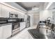 Updated kitchen features stainless steel appliances, granite countertops, and white cabinets at 13941 Talmage Loop, Hudson, FL 34667