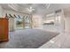 Spacious living area flowing to the screened patio, ideal for entertaining guests at 13941 Talmage Loop, Hudson, FL 34667