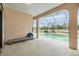 Screened-in pool and patio area with peaceful backyard views at 13941 Talmage Loop, Hudson, FL 34667