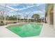Relaxing screened-in pool area featuring a waterfall, perfect for enjoying the outdoors at 13941 Talmage Loop, Hudson, FL 34667