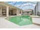 Sparkling pool and screened-in patio offering privacy at 13941 Talmage Loop, Hudson, FL 34667